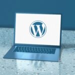 Computer with the WordPress logo on it by Deng Xiang on Unsplash: https://unsplash.com/photos/a-laptop-computer-sitting-on-top-of-a-table-YBtAJPcvc4Y
