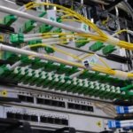 Network rack with bundled cables by Kirill Sh on Unsplash: https://unsplash.com/photos/green-and-white-electric-device-eVWWr6nmDf8