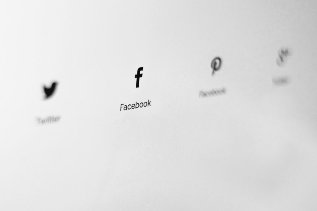 Social media icons displayed on a website by Nordwood Themes on Unsplash: https://unsplash.com/photos/facebook-icon-cNXqmO0Z24U