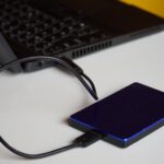 Photo of a external hard drive plugged into a laptop by Budget Bizar on Pexels: https://www.pexels.com/photo/portable-laptop-power-bank-15882042/