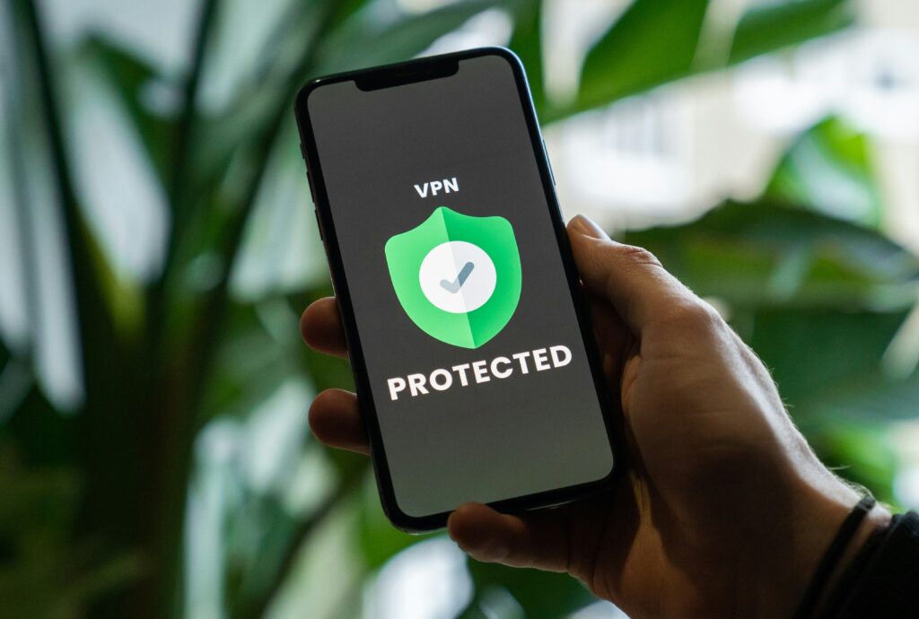 Man looking at his phone screen with a vpn on it.